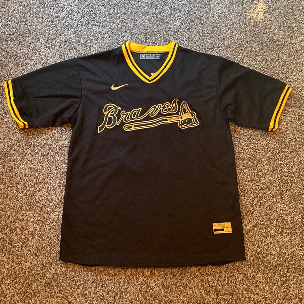 Black and gold Braves jersey. Acuña Jr. #13